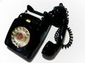 A vintage and antique telephone with white background.